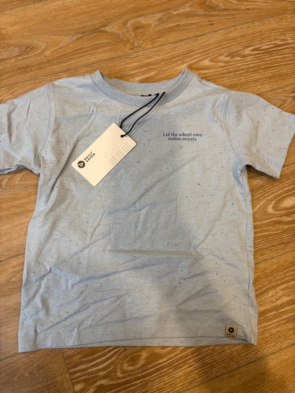 Kids Light Blue Speckled Tee with 'Let the wheels own italian streets' -